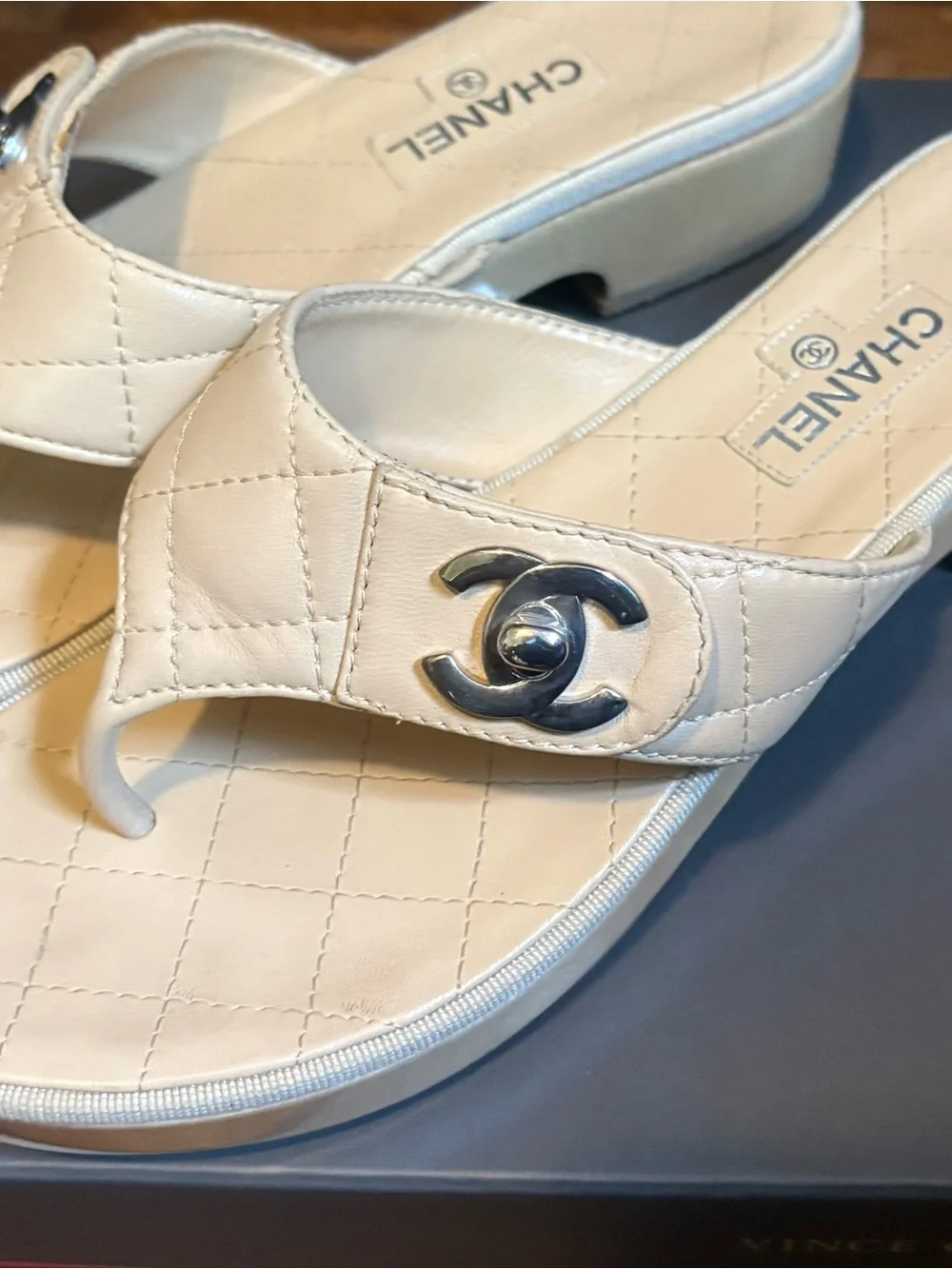 CHANEL Quilted Leather Thong Mules in Cream with Silver CC Logo